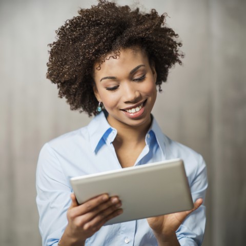 Woman learning a language with Premium PLUS on a tablet