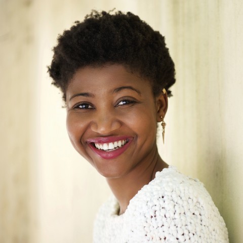 Head and Shoulders of a Beautiful, Smiling, Modern Young African Woman.