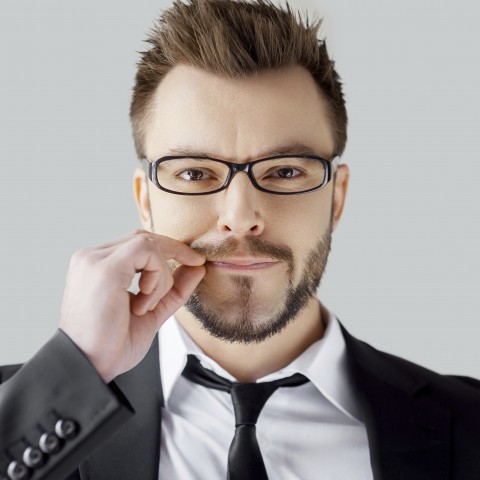 Man Making the Sealed Lips Sign