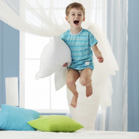 A Little Kid Jumping on the Bed