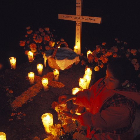 A grave decorated for All Saints' Day