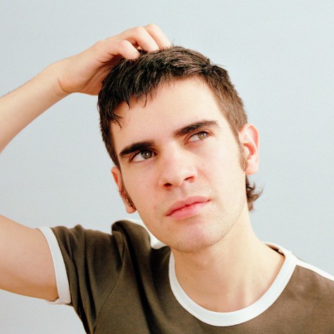 Man Scratching His Head in Confusion