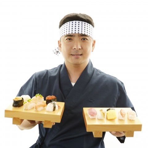 Man Holding Sushi Trays in Each Hand