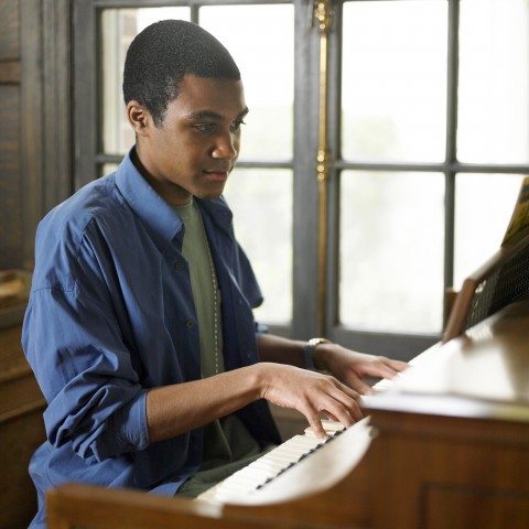 A Young Man Playing the Piano