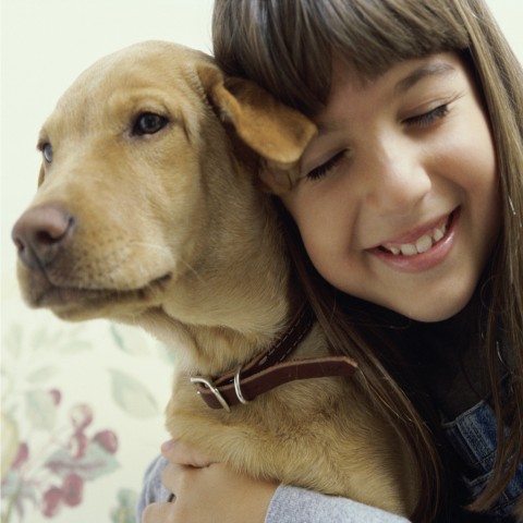 Girl Hugging Dog