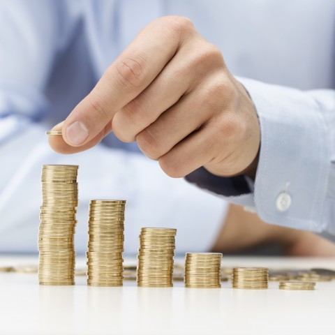 Someone Counting Stacks of Coins