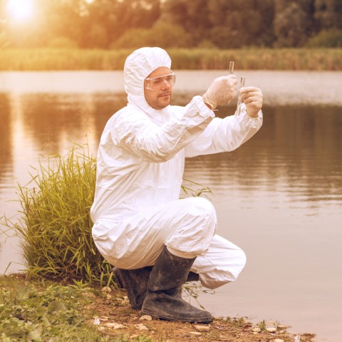 A Man Getting Water Sample