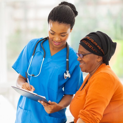 Nurse Speaking with Patient