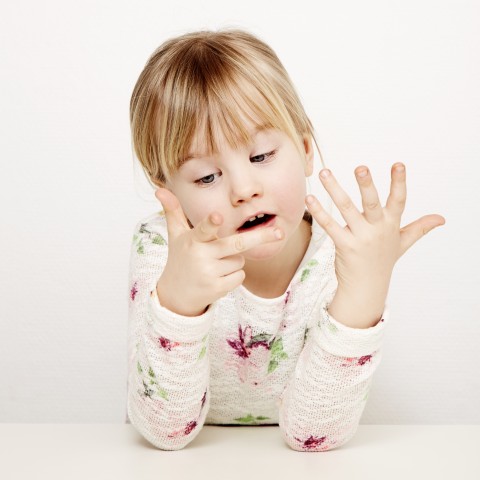 Little Girl Counting on Her Fingers