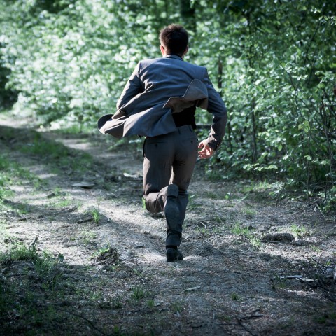 A Guy Running in the Forest