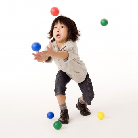 Child Playing with Balls
