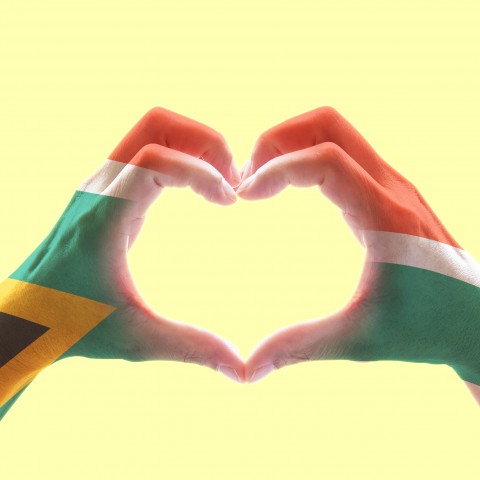 South African Flag Painted on Hand Make a Heart Shape