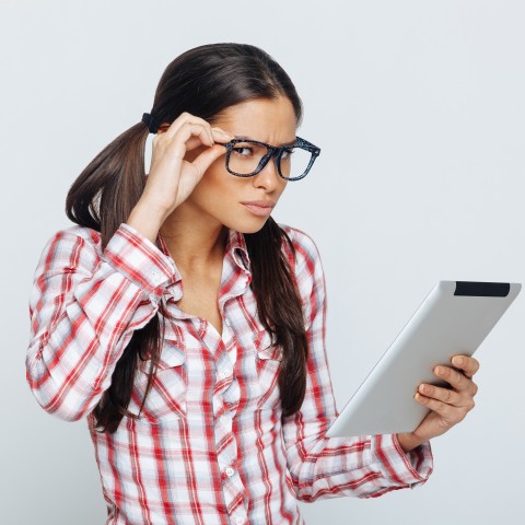 Woman Reading with Confused Look