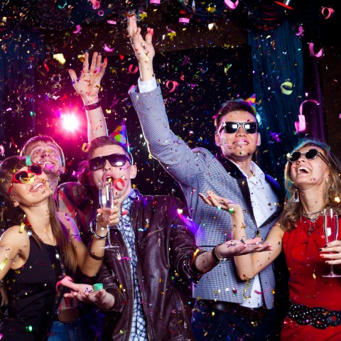 People at a Party with Confetti and Drinks