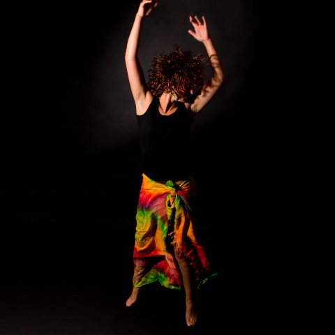 Dancing Against Black Background