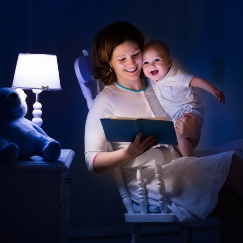 Mother Reading to Her Baby