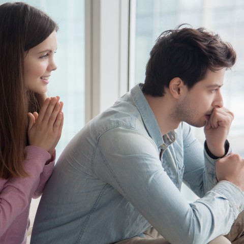 Couple Looking Out a Window