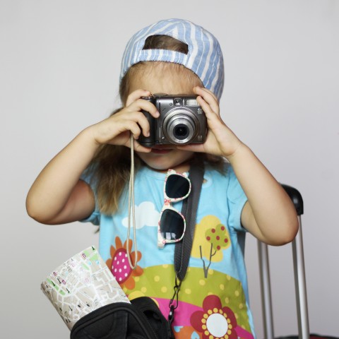 A Pretty Young Traveling Girl Taking a Picture