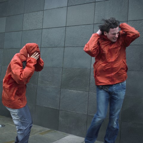 Two People in Heavy Wind