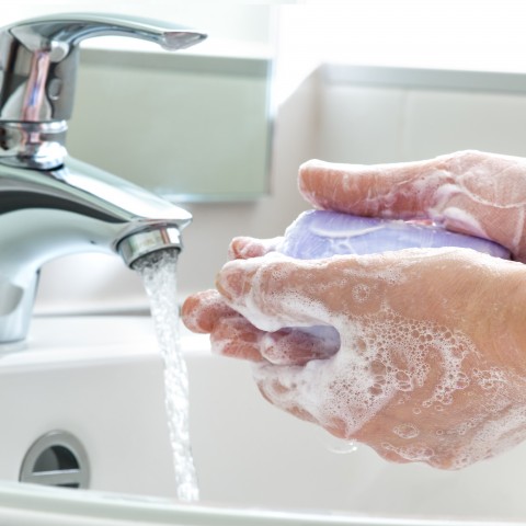 Person Washing Hands