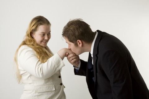 A Man Kissing a Woman’s Hand