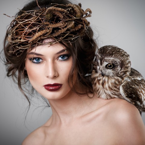 An Owl Resting on a Woman’s Shoulder