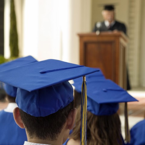 Graduate Student Holding a Diploma