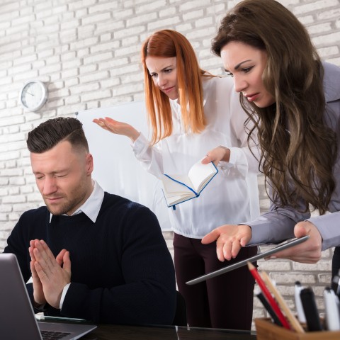 A Man and Two Women in an Office