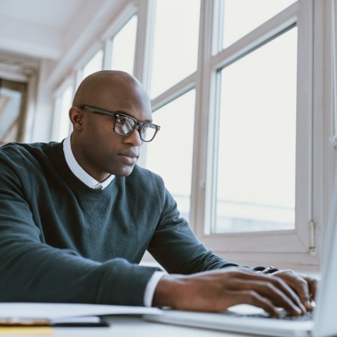 A man working on localization at a table