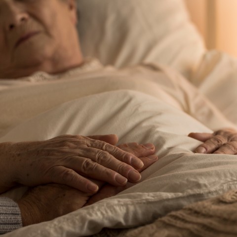 Elderly Person Lying in Bed