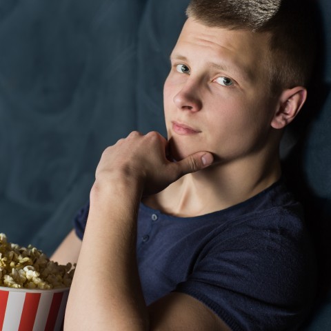 A Guy at the Movie Theater Making the Pogi Sign