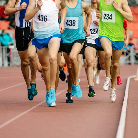 A Group of Runners on a Running Track