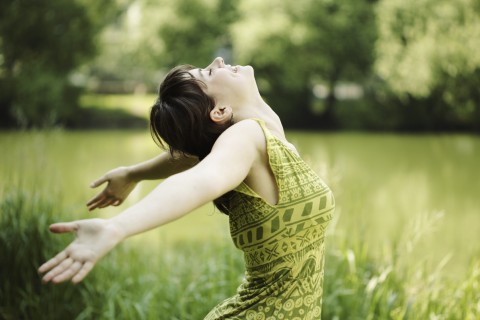 A Smiling Woman in a Green Dress.