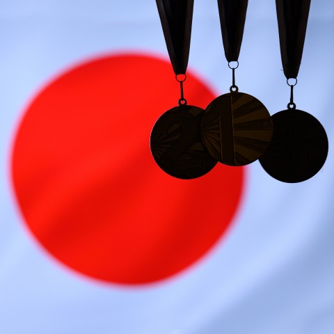 The Japanese National Flag with the Shadow of 3 Medals