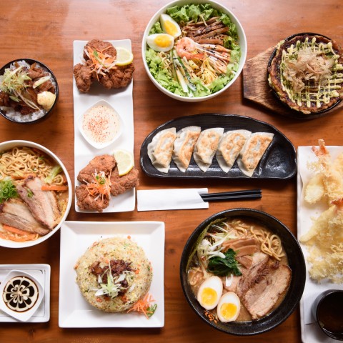 A Table Containing Plates of Different Delicacies