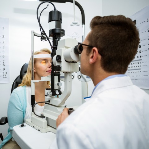 An Optometrist Examining a Woman’s Eyes