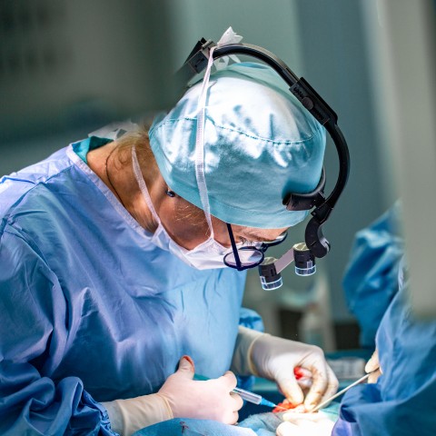 A Surgeon Operating on a Patient