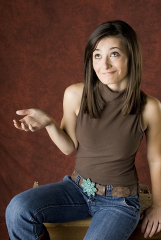 A Woman Shrugging with an Uncertain Look on Her Face 