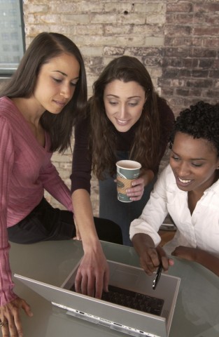 People looking at a laptop