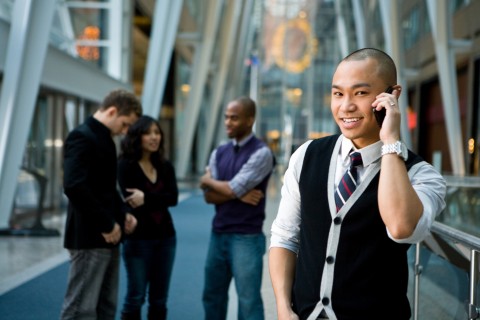 A Young Man Talking on His Cell Phone in a Street.