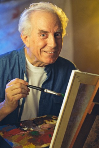 An Old Man Painting Something