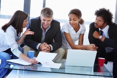 Four Colleagues Discussing Something Important 