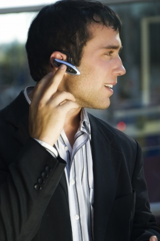 Man in Suit with Earphones On