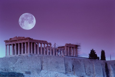 The Parthenon on the Acropolis beneath a full moon in Athens, Greece