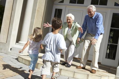 Two Kids Running Towards Their Grandparents