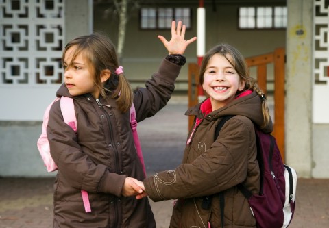 Two Girls Trying to Catch a School Bus