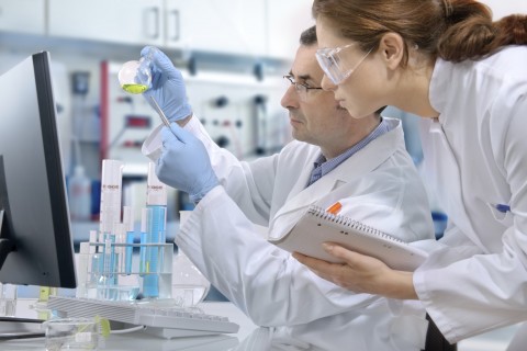 Two People in a Laboratory Running Tests