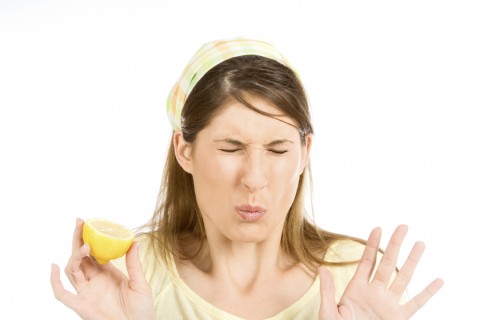 The Reaction of a Woman While Tasting a Lemon