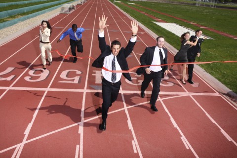 People in Formal Work Clothes Crossing a Finish Line