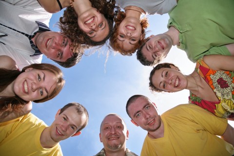 Group of People Standing in a Circle
